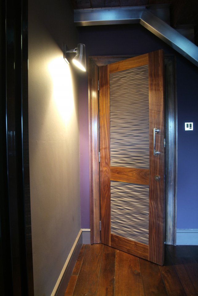 bespoke walnut door with wavy MDF panels