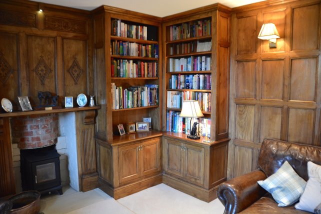 Fitted study/TV room with oak bookcases, overmantel and 17th century panelled room