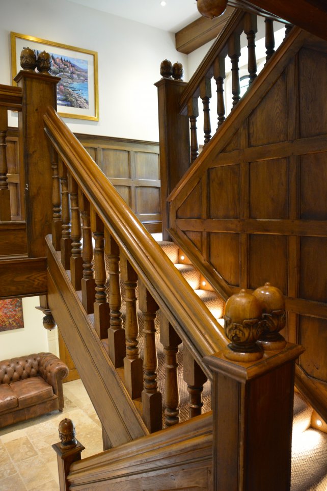 period oak staircase panelling with solid oak newel posts, balusters, handrail and hand carved acorn finials
