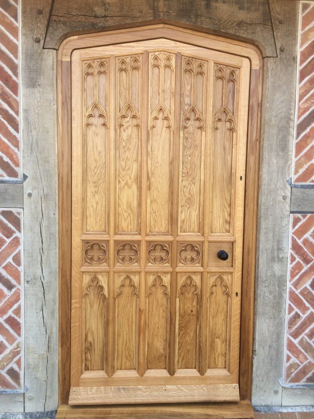 gothic front door with hand carved tracery panels in solid oak