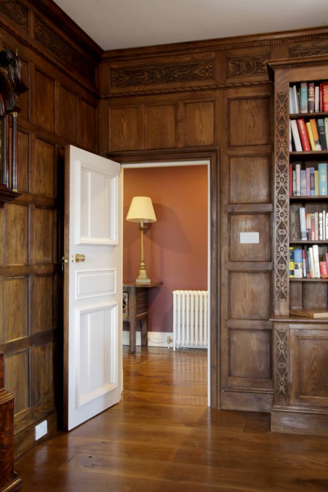 2 panelled painted door within a full panelled room