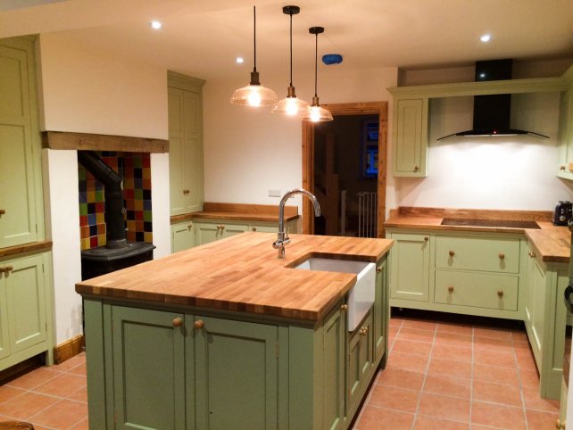 painted kitchen with freestanding island unit with belfast sink