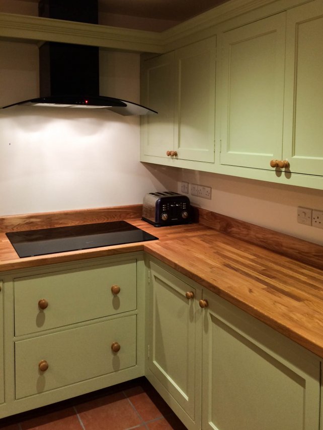 painted kitchen with deep pan drawers and oak work top