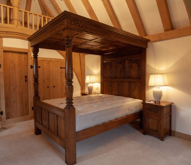 4 poster bed with carving