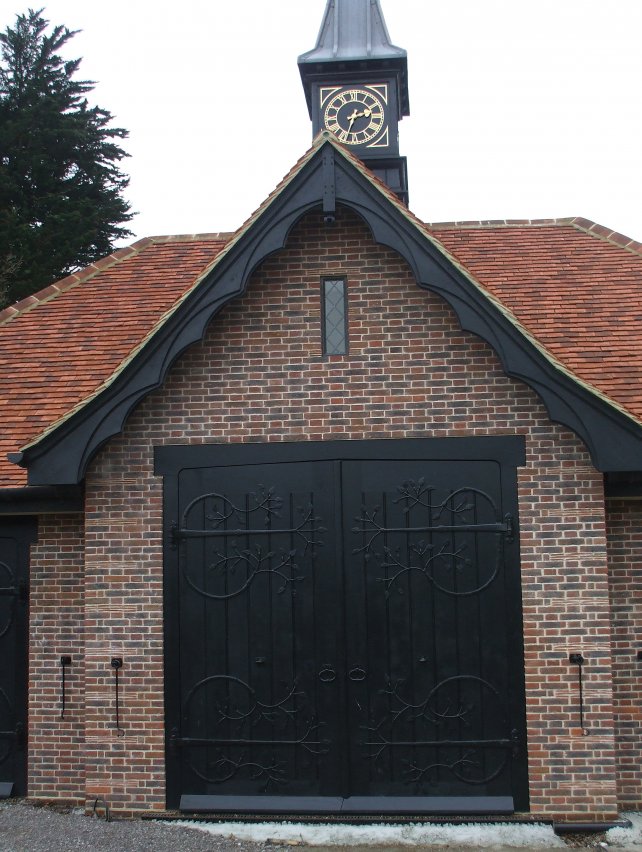 large bespoke garage doors with handmade ornate ironwork