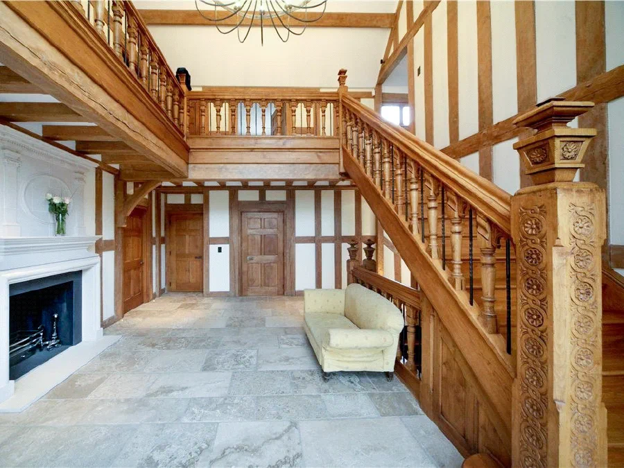 Large timber-framed hall with an oak staircase and galleried landing