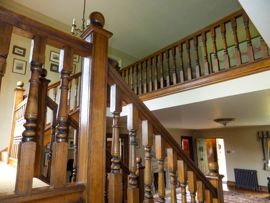 Oak staircase with turned balusters and substantial square newels